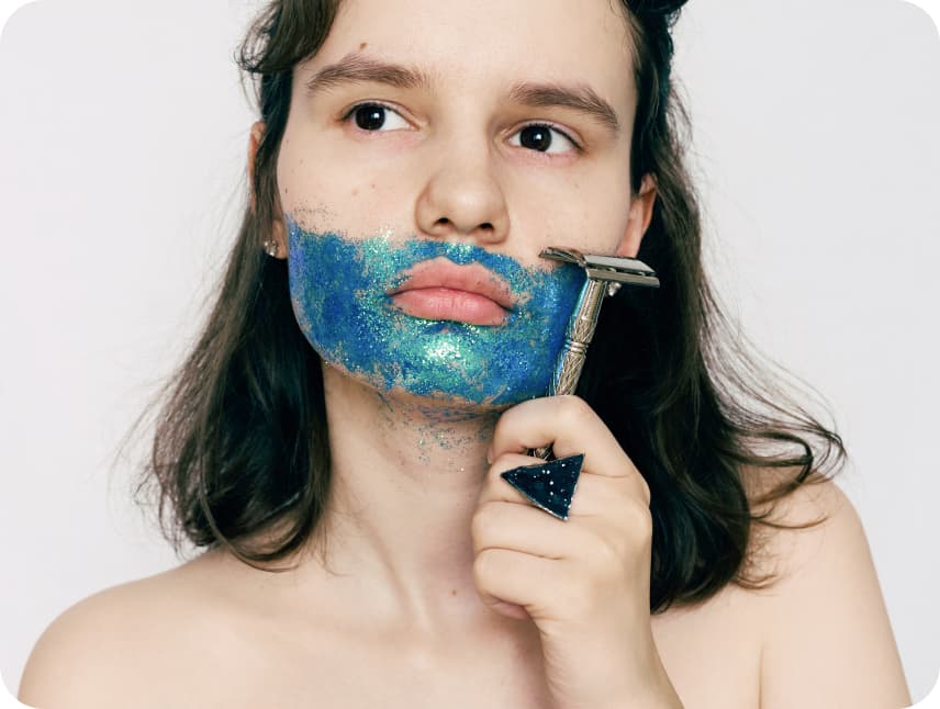 Woman shaving face